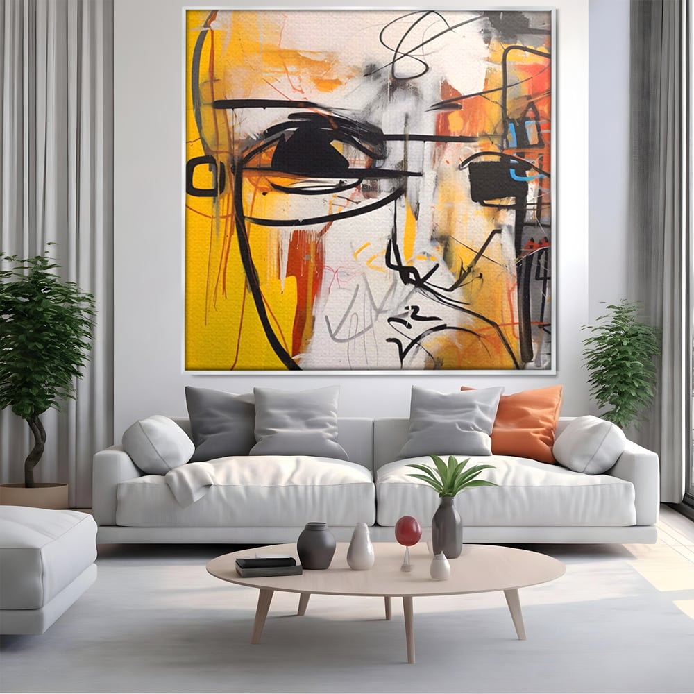Tablou canvas cu pictura abstracta cu chip stilizat, in rama de aluminiu argintiu, pe perete intr-un living